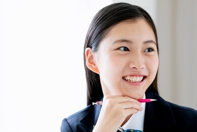 a smiling female student studying