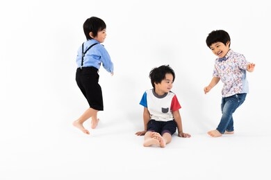 portrait of boys in front of white wall