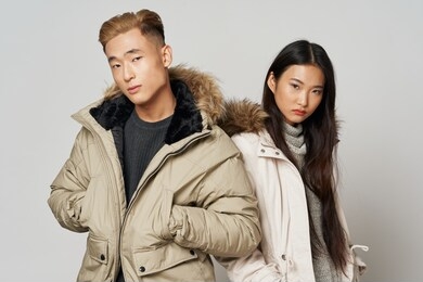 beautiful elegant couple of asian appearance winter jackets luxury studio lifestyle