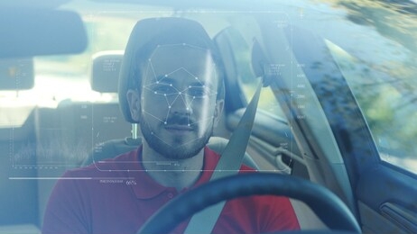 future. face detection. technological 3d scanning. biometric facial recognition. face id. technological scanning of the face of handsome caucasian man in the car for facial recognition. 