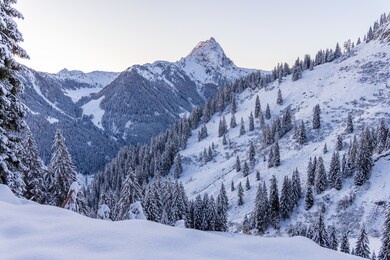 sunrise in the austrian alps, tirol tyrol peak of grosser rettenstein in the morning light, covered in snow 