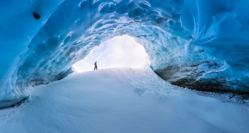 whistler, british columbia, canada. beautiful view of the ice cave in the alpines on top of blackcomb mountain with people visiting.