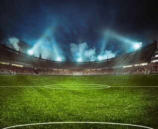 football stadium with the stands full of fans waiting for the night game