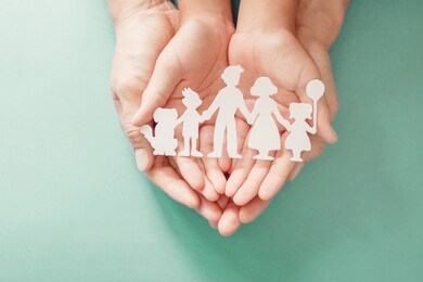 adult and children hands holding paper family cutout, family home, adoption, foster care, homeless support, family mental health, social distancing concept