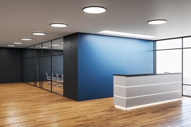 modern office hall with reception desk and copy space on blue wall. workplace and lifestyle concept. 3d rendering