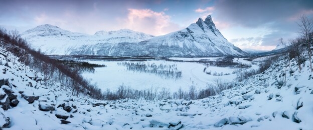 panorama of snowy fjords and mountain range, senja, norway amazing norway nature seascape popular tourist attraction. best famous travel locations. beautiful sunset within the amazing winter landscape