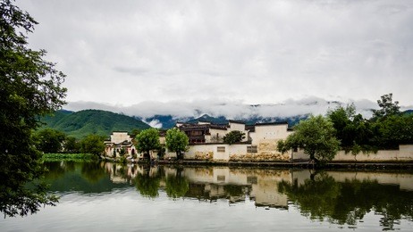 raining days in hongcun. it's an ancient village near huangshan, world heritage site by unesco, has many wonderful traditional chinese architectures and carvings, red lanterns along the central lake.