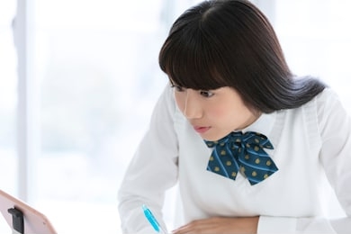 a female student wearing a uniform to study