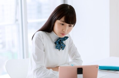 a female student wearing a uniform to study