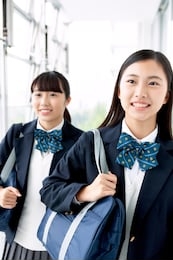 a smiling female student looking far away