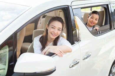 two women riding a car