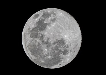 full moon stack dark night sky. the full moon is lunar phase when it appears fully illuminated from earth's perspective. it occurs when earth is located between sun and moon appears as a circular disk