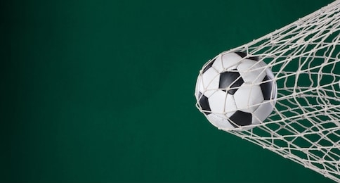 goal net, soccer ball in goal, green background