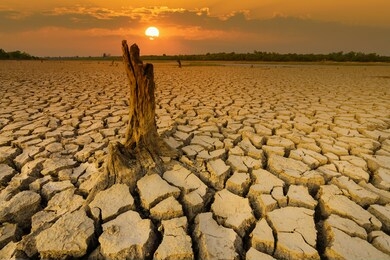 arid clay soil sun desert global worming concept cracked scorched earth soil drought desert landscape dramatic sunset