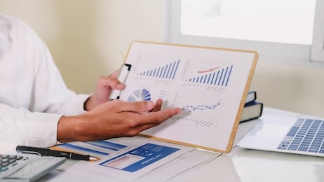 asian business adviser meeting to analyze and discuss the situation on the financial report in the meeting room.investment consultant,financial consultant,financial advisor and accounting concept

