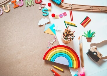 background for preschool or kindergarten or art classes. kids educational toys and school supplies for draw and make diy crafts. flat lay top view. art child frame with empty paper, mock up for text