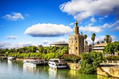 golden tower (torre del oro) along the guadalquivir river, seville (andalusia), spain. 