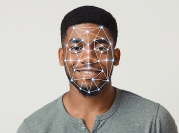 cyber safety concept. facial scanning of african american guy in casual clothes on light background