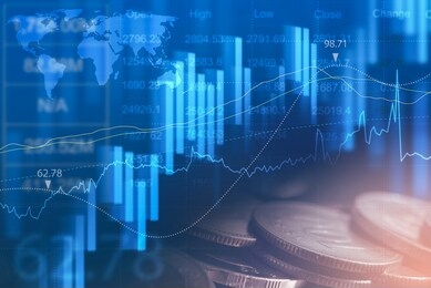 financial graph, stock market report, world economic growth, finance and investment concept. double exposure of candlestick graph and coin stacks on abstract glowing blue technology backgrounds