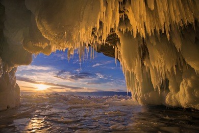  lake baikal in winter. sunset in the icy cave