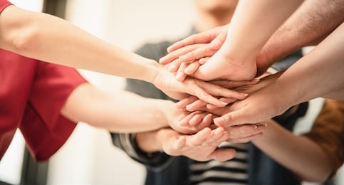 stack of hand from volunteering of people to show  teamwork spirit togetherness, concept of young generation diversity to create achievement in the future, volunteer of people for social sacrifice.