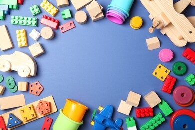 set of different children's toys on a colored background top view. a place to insert text, minimalism. baby background.
