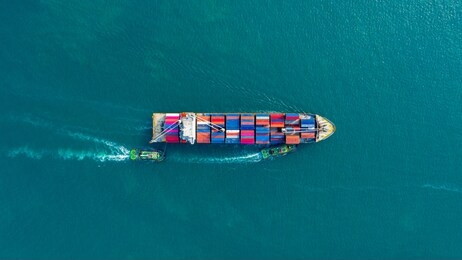 aerial view cargo ship of business logistic transportation sea freight, cargo ship, cargo container in factory harbor at industrial estate for import export around in the world, trade port / shipping 