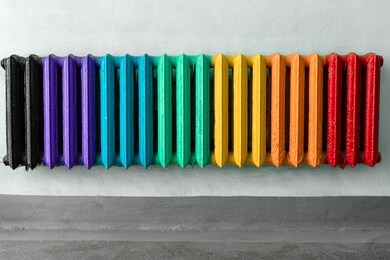 vintage heating radiator made from cast iron. colorful and hipster convector in room as a background for copy space