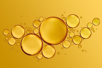 golden drops of oil or serum surface background
