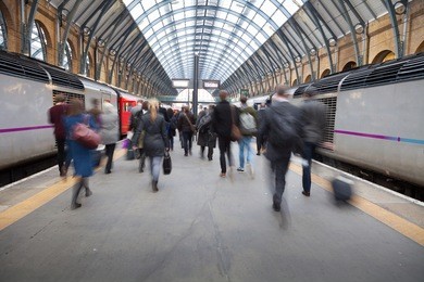 london train tube station blur people movement in rush hour at king's cross station, england, uk 