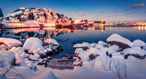 incredible winter cityscape of reine town, norway, europe. calm evening scene of lofoten islands. great sunset on norwegian sea.  life over polar circle. traveling concept background.
