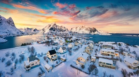 view from flying drone of reine village, moskenesoya island, norway, europe. aerial evening scene of lofoten islands. fantastic winter sunset on norwegian sea. life over polar circle.
