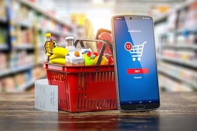 shopping basket with fresh food and smartphone. grocery supermarket, food and eats online buying and delivery concept. 3d illustration