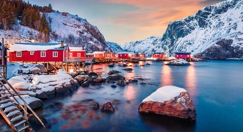 fantastic evening cityscape of nusfjord town, norway, europe. great sunset on lofoten island archipelago. fabulous winter seascape of norwegian sea.  life over polar circle.