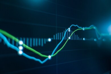 stock market trading graph and candlestick chart on screen monitor for financial investment and economic concept. 