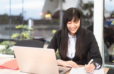 business asian woman working on computer outdoor - happy chinese girl using laptop in office - professional job and people lifestyle technology concept 