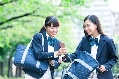 female student with a smartphone