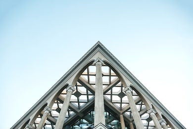 close up of a symmetrical or symmetry point of view on the corner of a building with columns.
