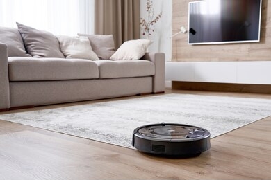 robotic vacuum cleaner on the floor in cozy modern living room