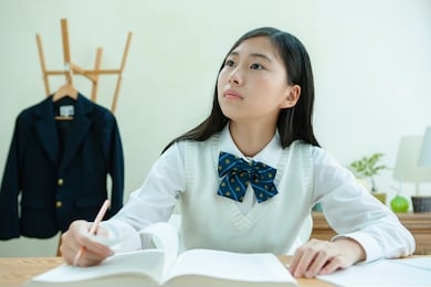 a female student wearing a uniform to study