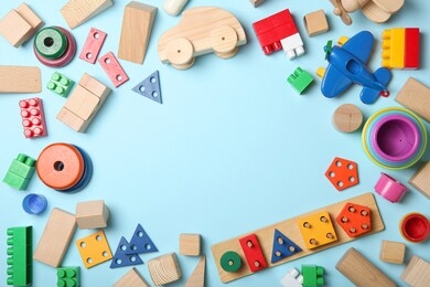 set of different children's toys on a colored background top view. a place to insert text, minimalism. baby background.
