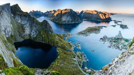 sunset aerial panoramic view on stunning mountains and village of reine in lofoten islands, norway, from reinebringen ridge