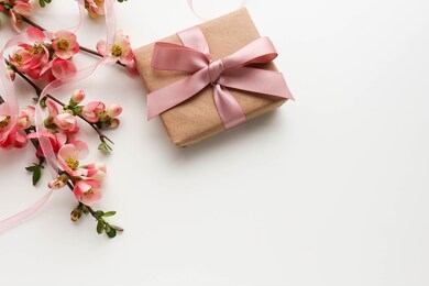 greeting card design. gift concept. gift box, flowers and an envelope on a white background. invitation. congratulation