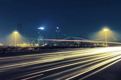 the light trails on the modern building background in city