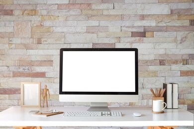 workspace desk and laptop. copy space and blank screen. business image, blank screen laptop and supplies.