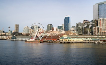 waterfront piers dock buildings needle ferris wheel seattle elliott bay