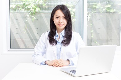 young doctor woman in ??consultation room