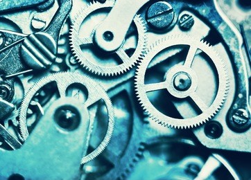 clock mechanism made in the technique of toning. very shallow depth of field. focus on the central gears