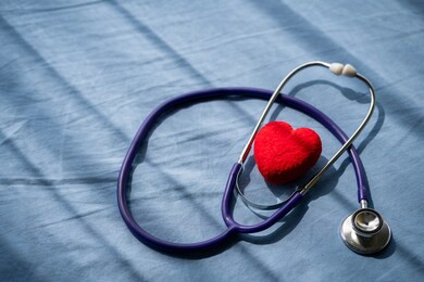 medical stethoscope and red heart on patient's bed.concept healthcare.