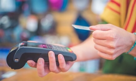 hand of customer paying with contactless credit card. payment by credit card